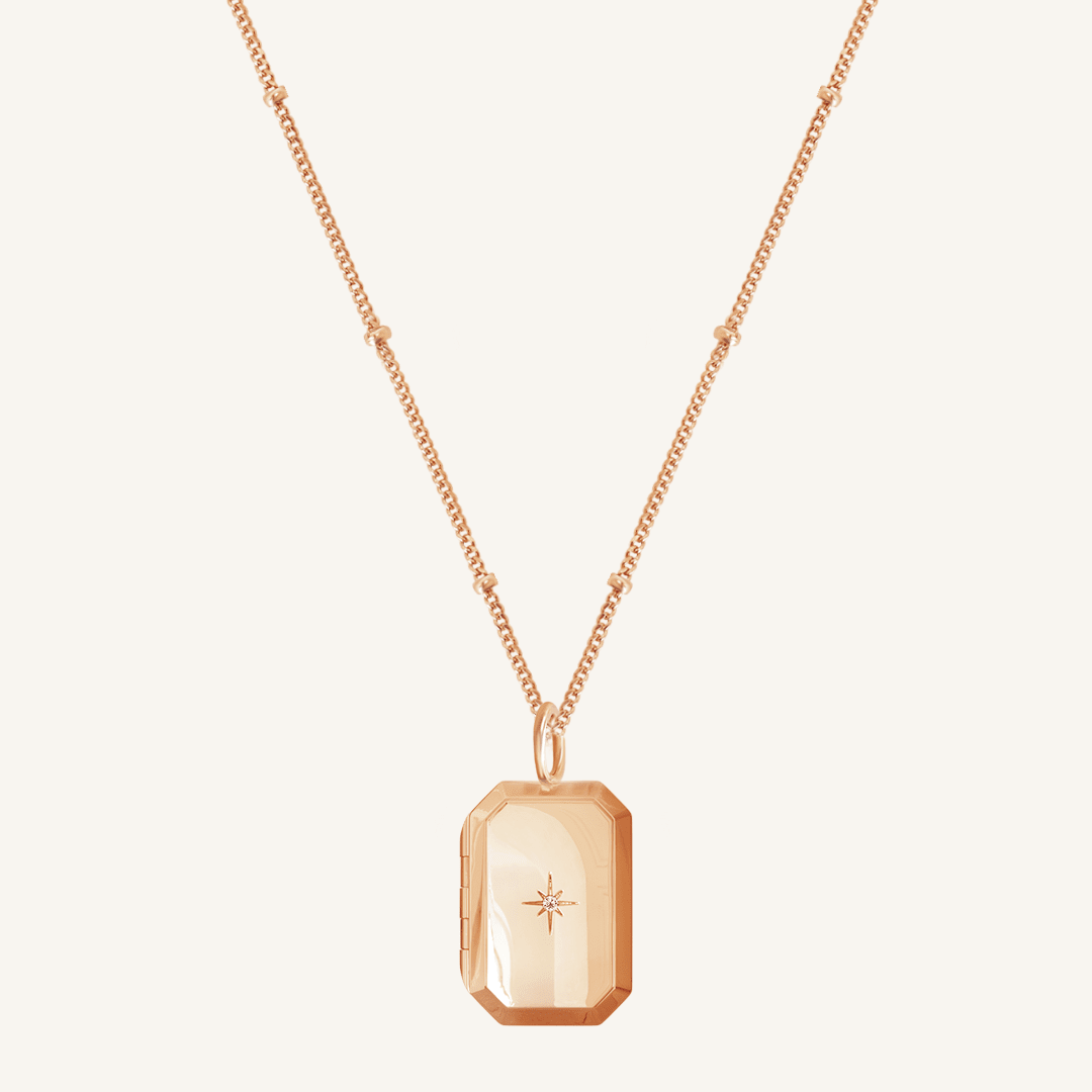Rose Bevel Locket on bobble chain on white background