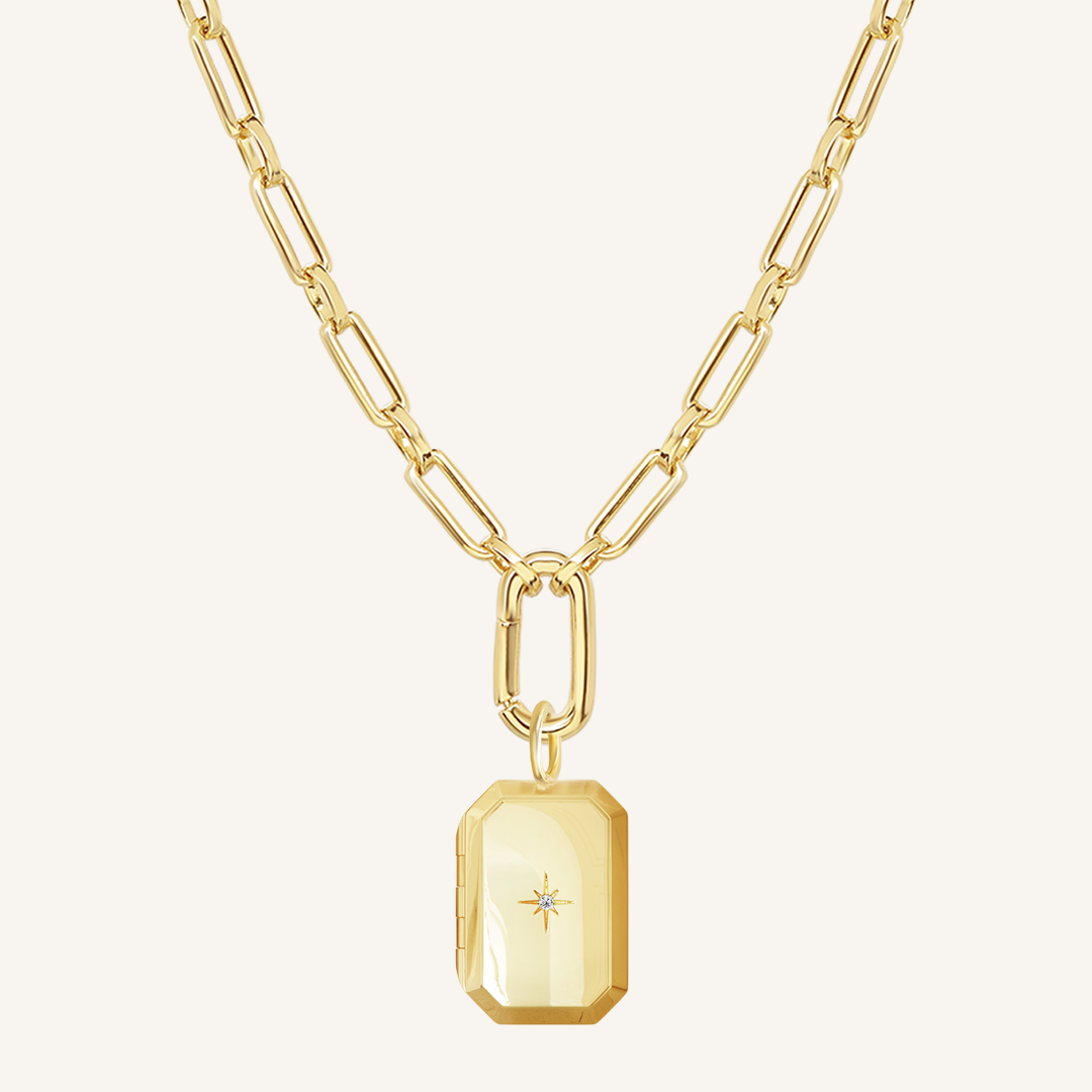 Gold Bevel Locket on link chain on white background