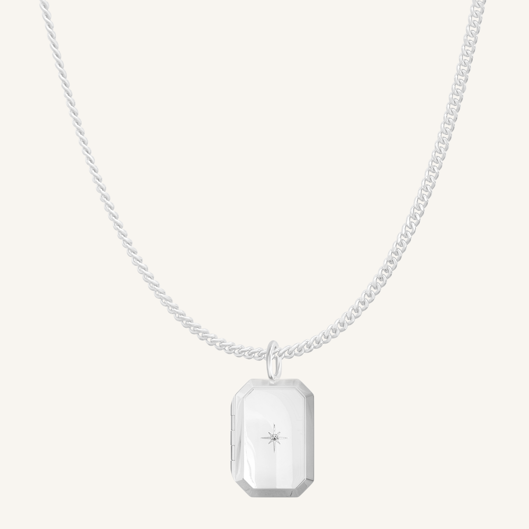SIlver Bevel Locket on curb chain on white background
