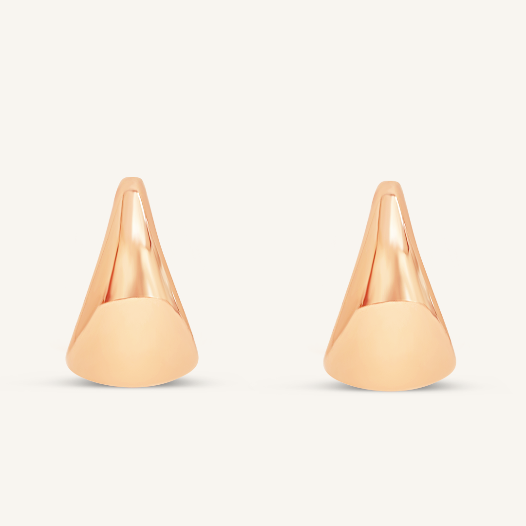 A pair of rose chunky hoop earrings on a white background.