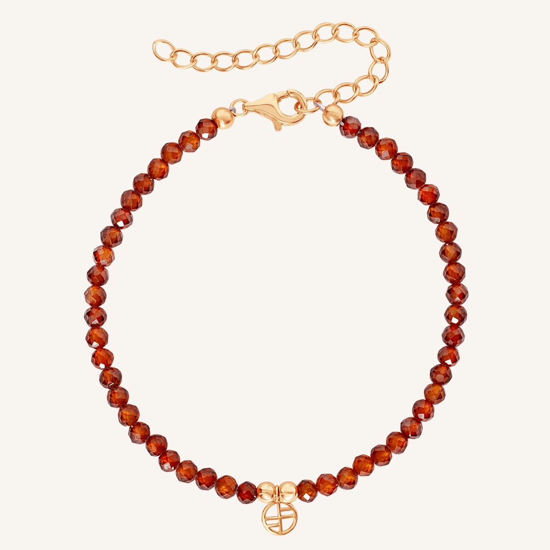 Beaded bracelet with rose clasp on a white background