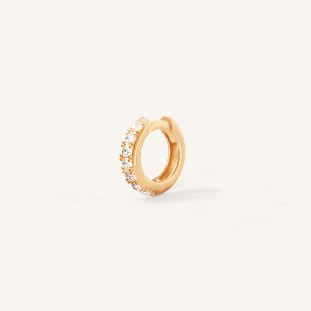 Small gold huggie, with cubic zirconias wrapped around