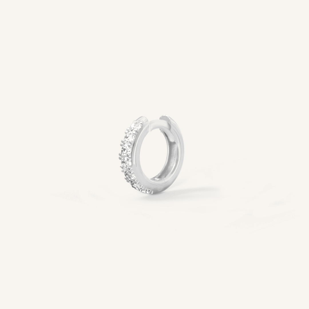 Small silver huggie, with cubic zirconias wrapped around