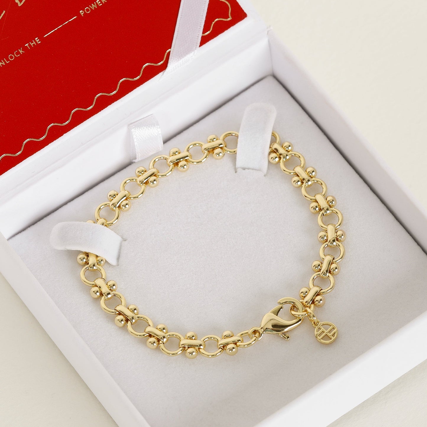 gold chain bracelet inspired by Eiffel tower in white and red box