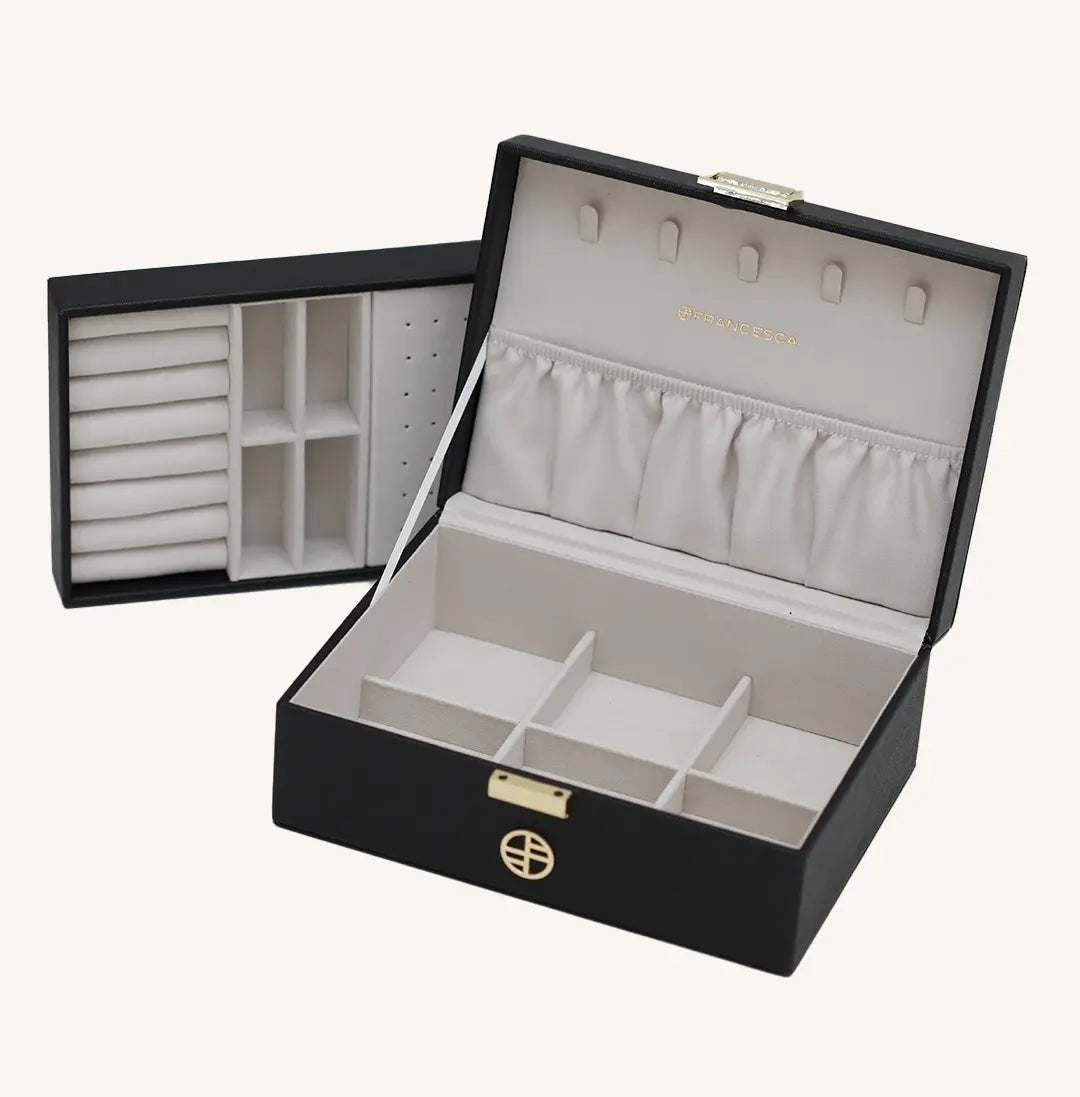 A black jewellery box with a lid, open sections for storing jewellery, and a necklace rack inside.