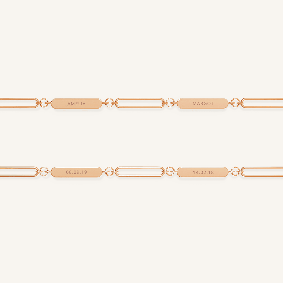 A rose chain necklace with two engraveable panels on a white background