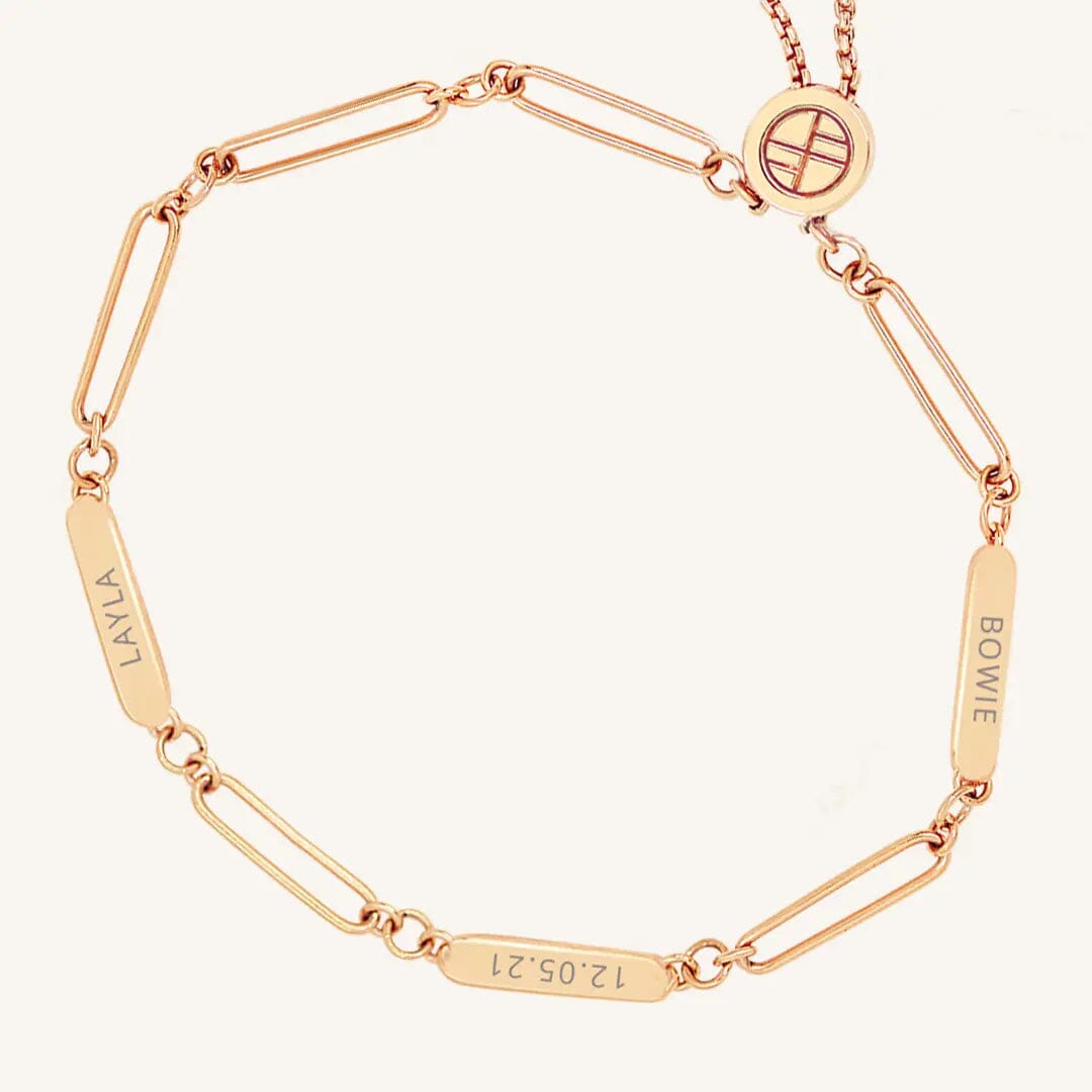 A rose Etch chain bracelet with three panels for engraving, featuring an adjustable fastening mechanism.