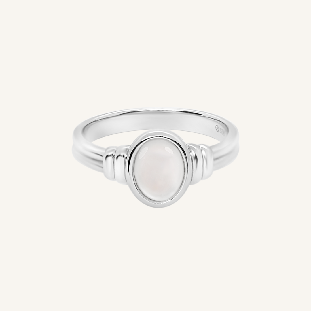 silver ring with a Mother of Pearl stone on a white background