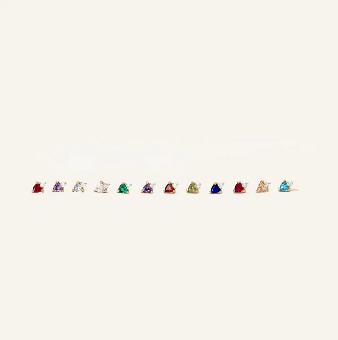 All birthstone studs displayed lined up from January to December on white background