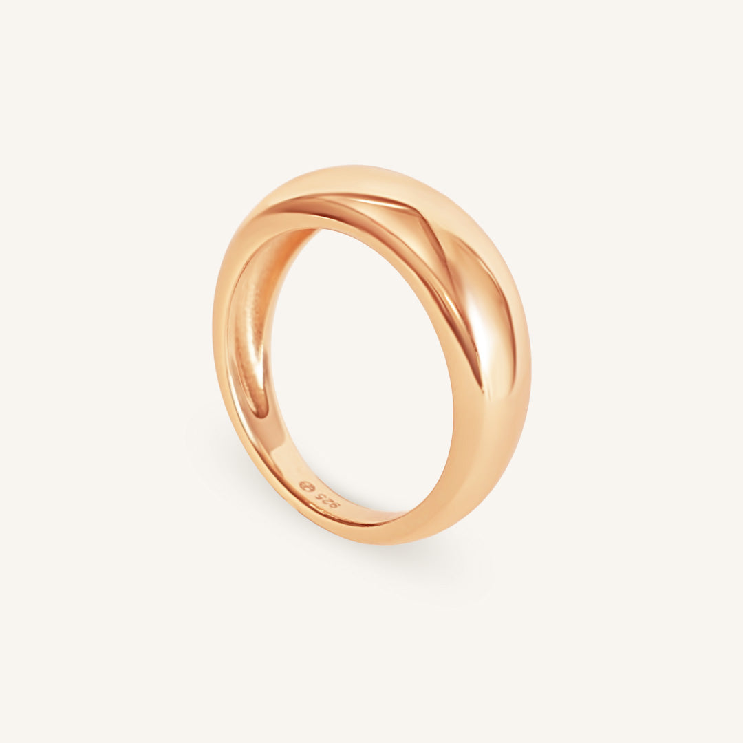 Rose gold ring on a white background
