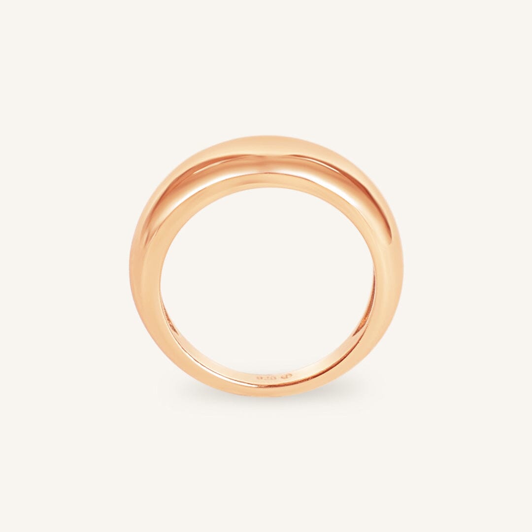 Rose gold ring on a white background