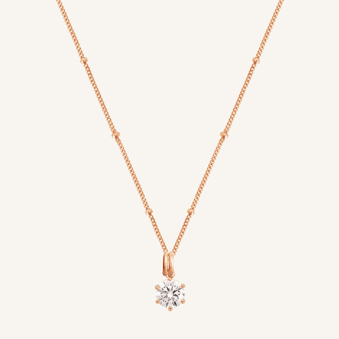 Round, rose, cubic zirconia charm on gold chain