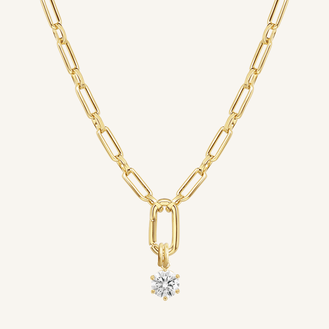 Round, gold, cubic zirconia charm on gold chain