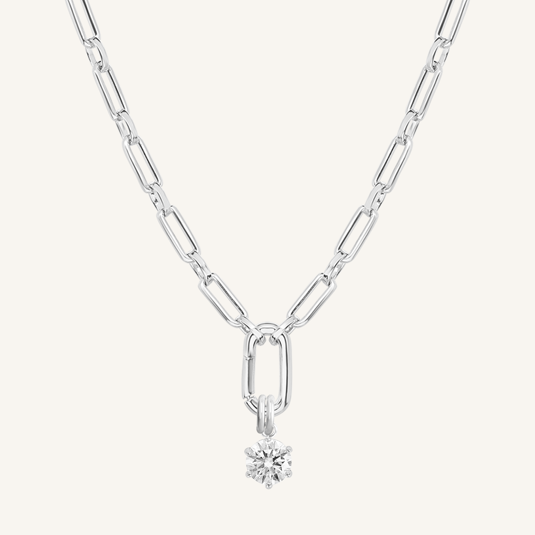 Round, silver, cubic zirconia charm on gold chain