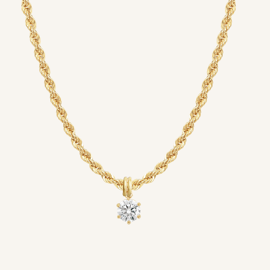 Round, gold, cubic zirconia charm on gold chain