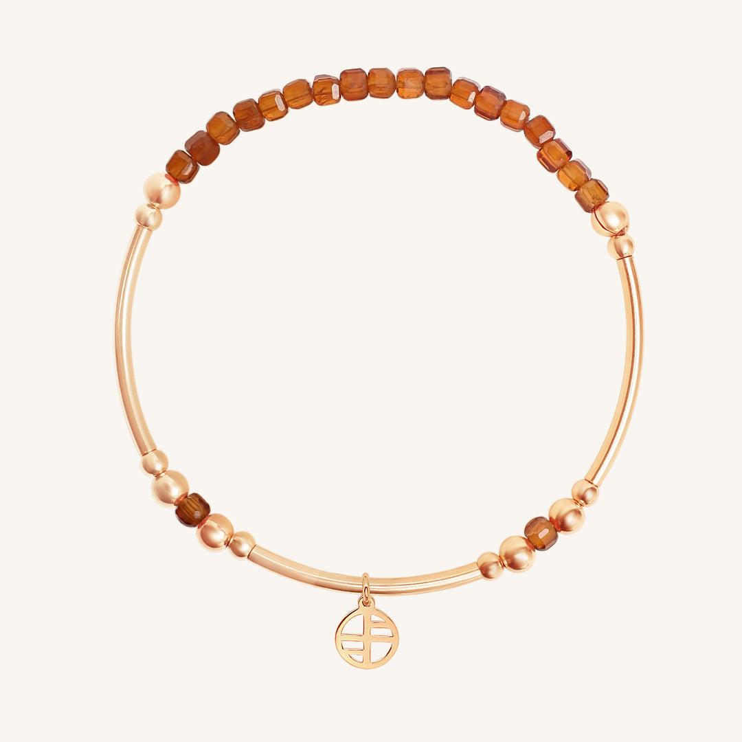 Bracelet with brown beads and rose accents on a white background