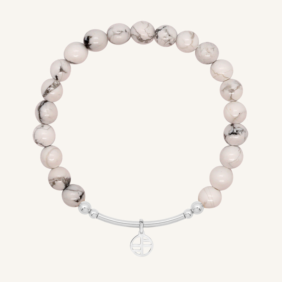 Bracelet with white marbled beads and a silver clasp on a white background