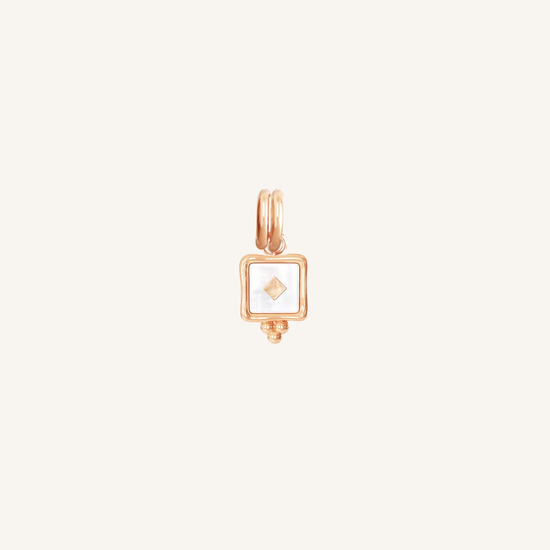 A small square-shaped intuition charm with a rose metal tone
