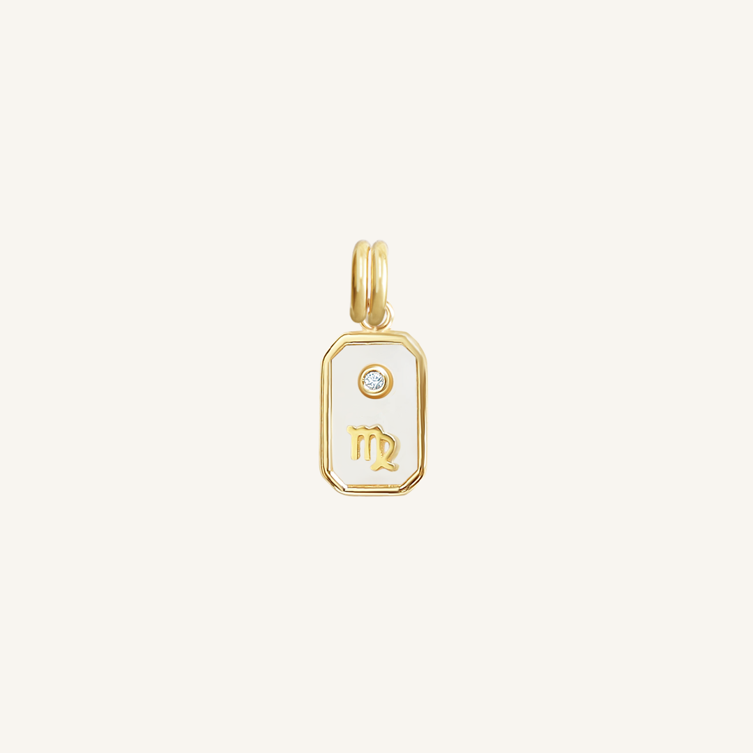 A gold iridescent zodiac charm representing the Virgo sign, with a loop for attachment, displayed against a white background.