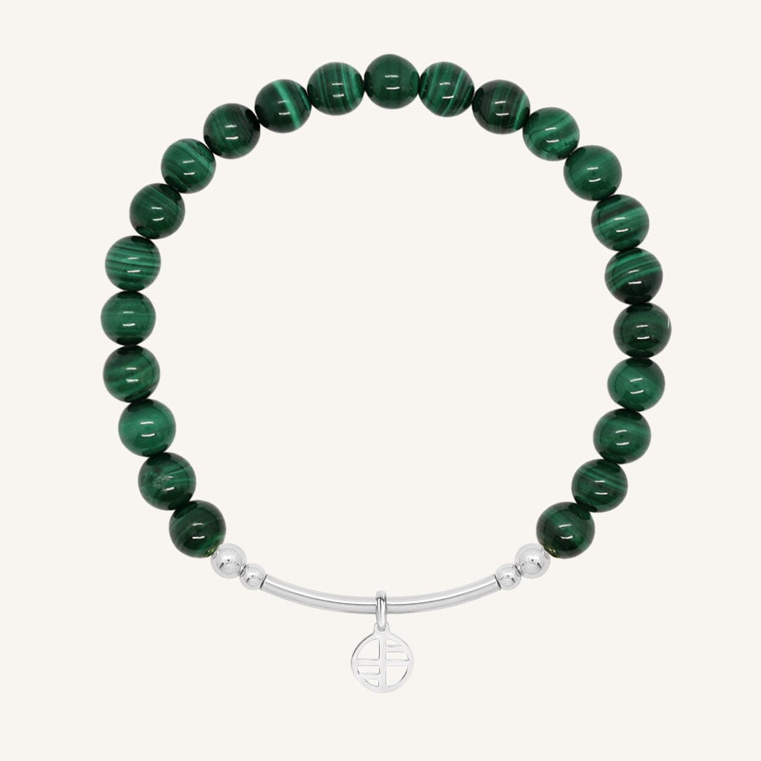 Green beaded bracelet with a silver bar on a white background