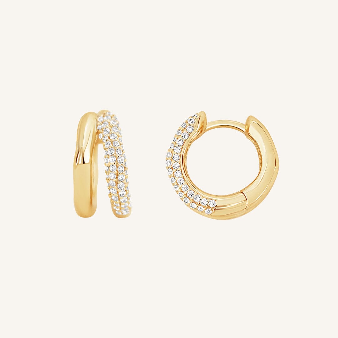 close up shot of gold double huggies with cubic zirconias