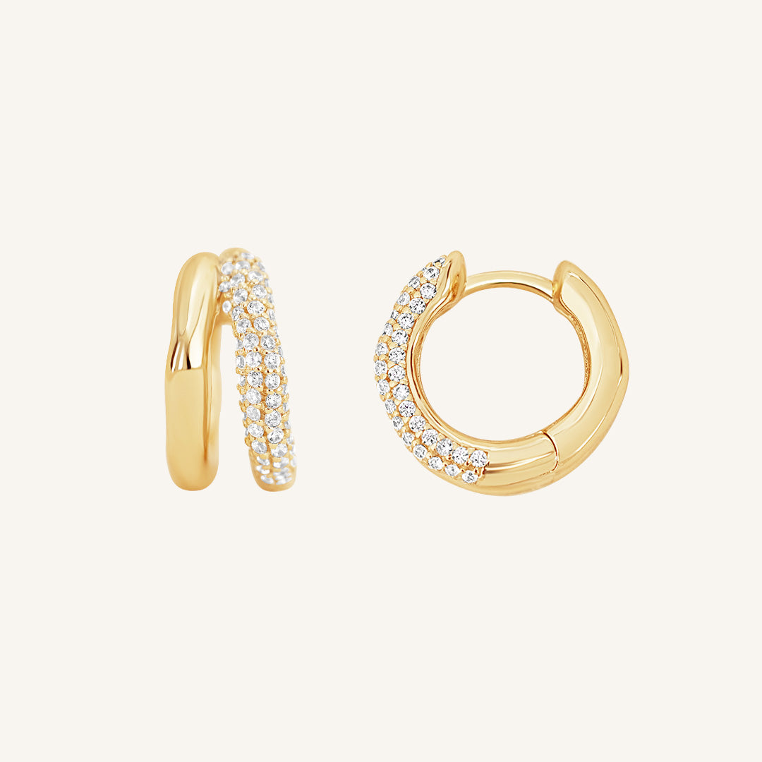 close up shot of gold double huggies with cubic zirconias