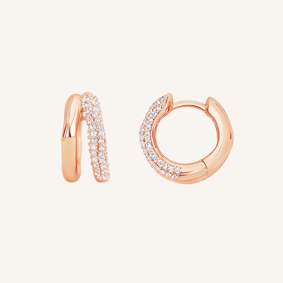 close up shot of rose gold double huggies with cubic zirconias