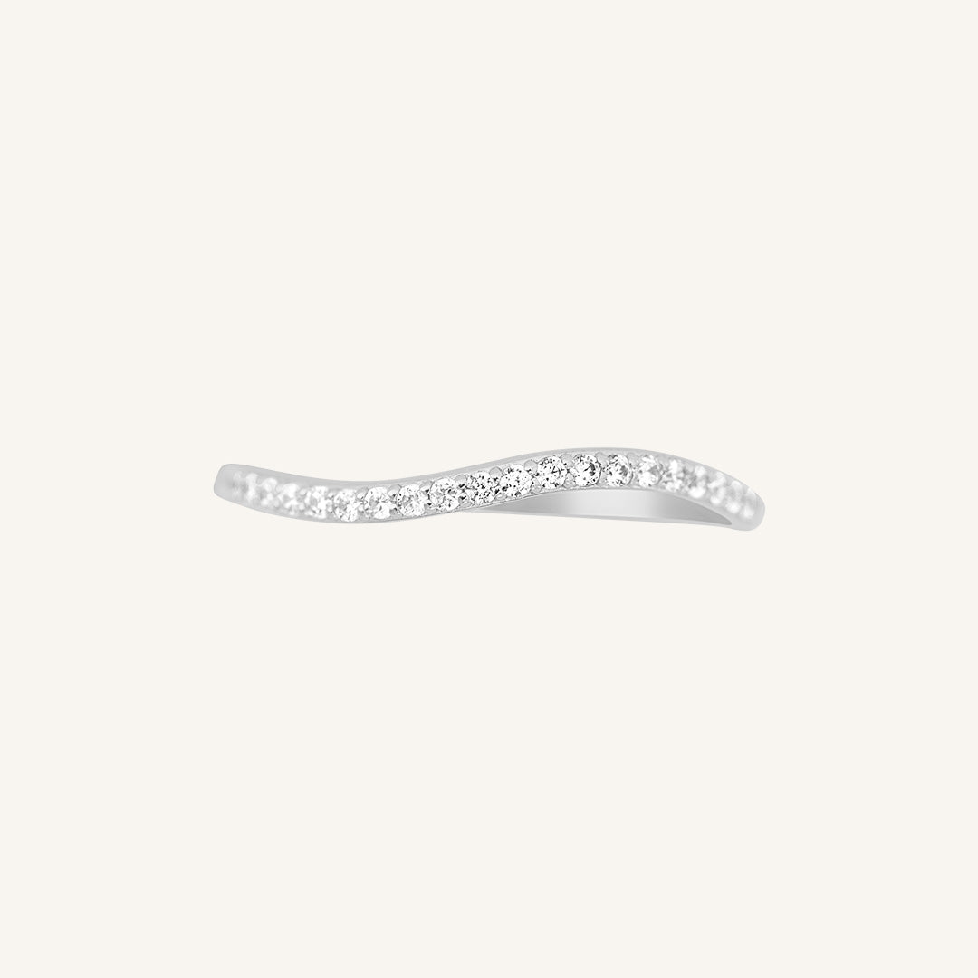 A slim, elegant ring with multiple small cubic zirconias set in a silver coloured band.