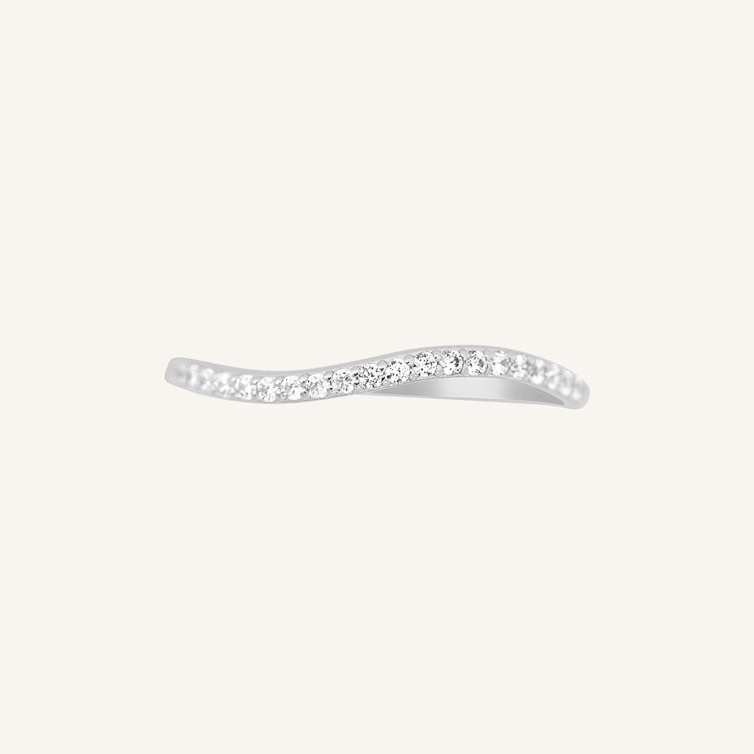 A slim, elegant ring with multiple small cubic zirconias set in a silver coloured band.