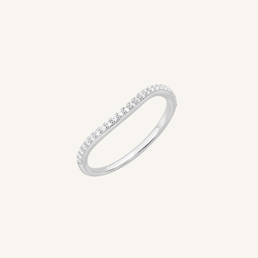 A slim, elegant ring with multiple small cubic zirconias set in a silver coloured band.