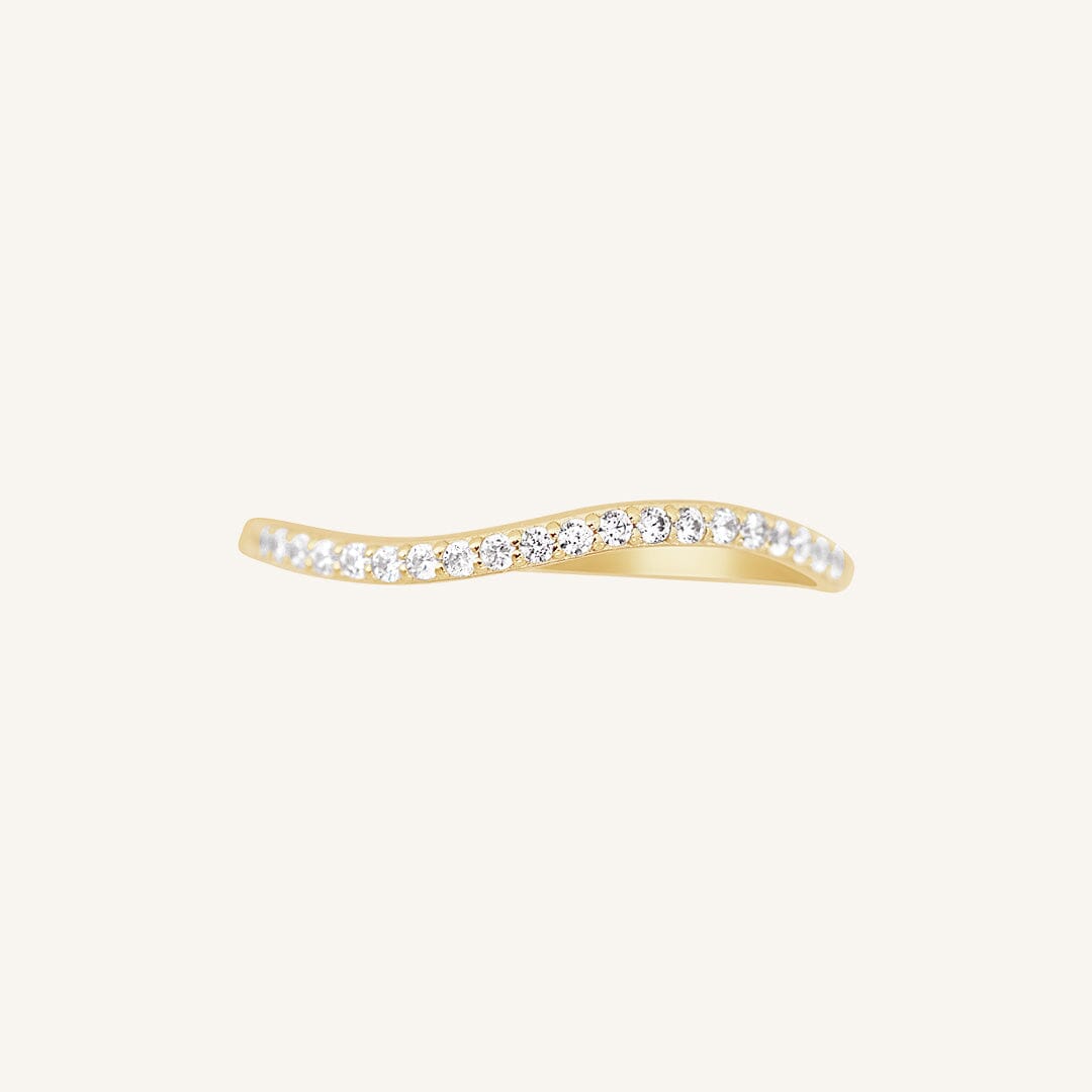 A slim, elegant ring with multiple small cubic zirconias set in a coloured band.