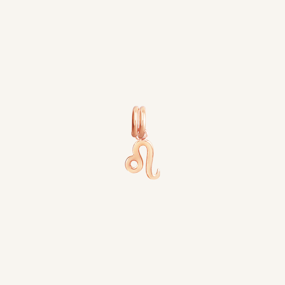 A rose gold Petite Zodiac Charm representing the Leo zodiac sign.
