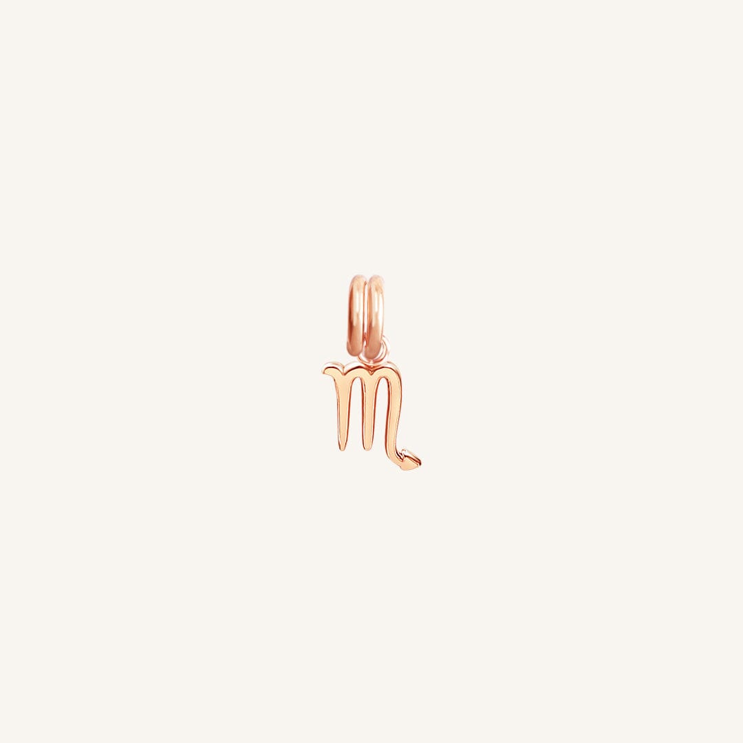 A rose gold-coloured Petite Zodiac Charm representing the Scorpio sign.