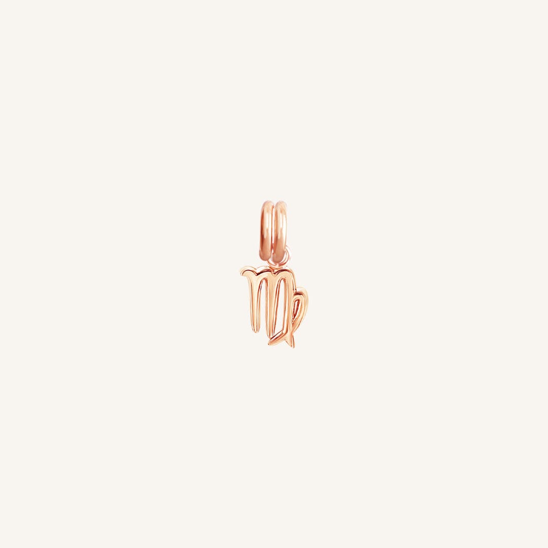 A rose gold coloured Petite Zodiac Charm representing the Virgo sign.