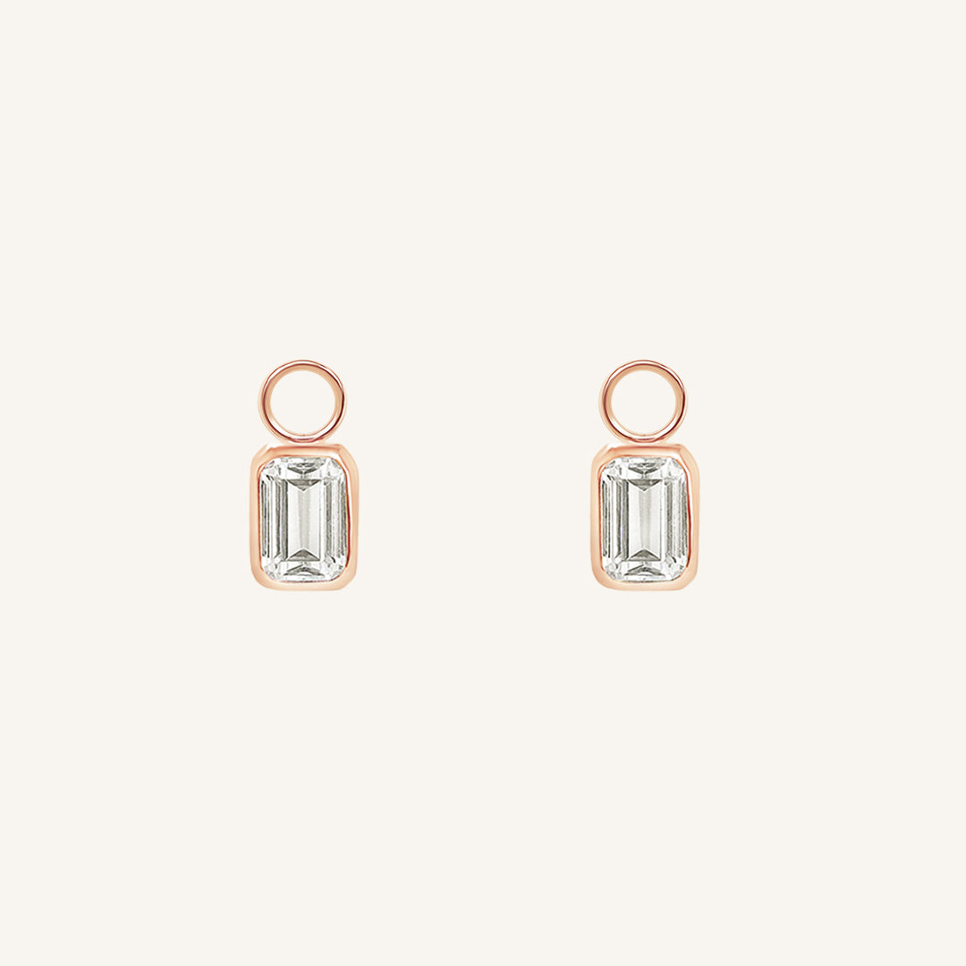 A pair of hoop charms with cubic zirconias designed to be added to hoop earrings.