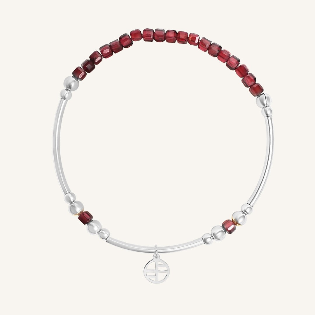 Bracelet with red and silver beads on a white background
