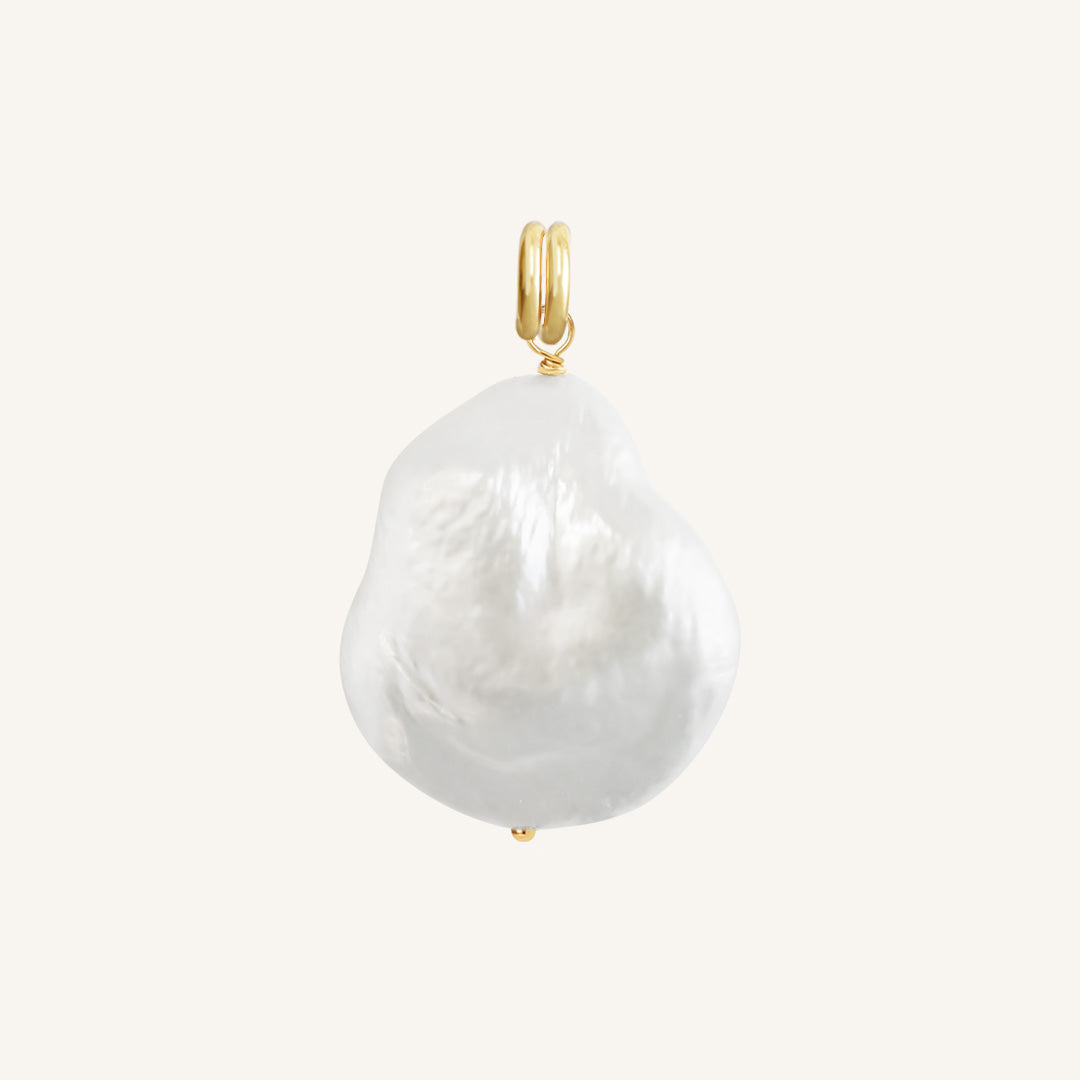 A single river pearl charm with gold findings, presented against a white background.