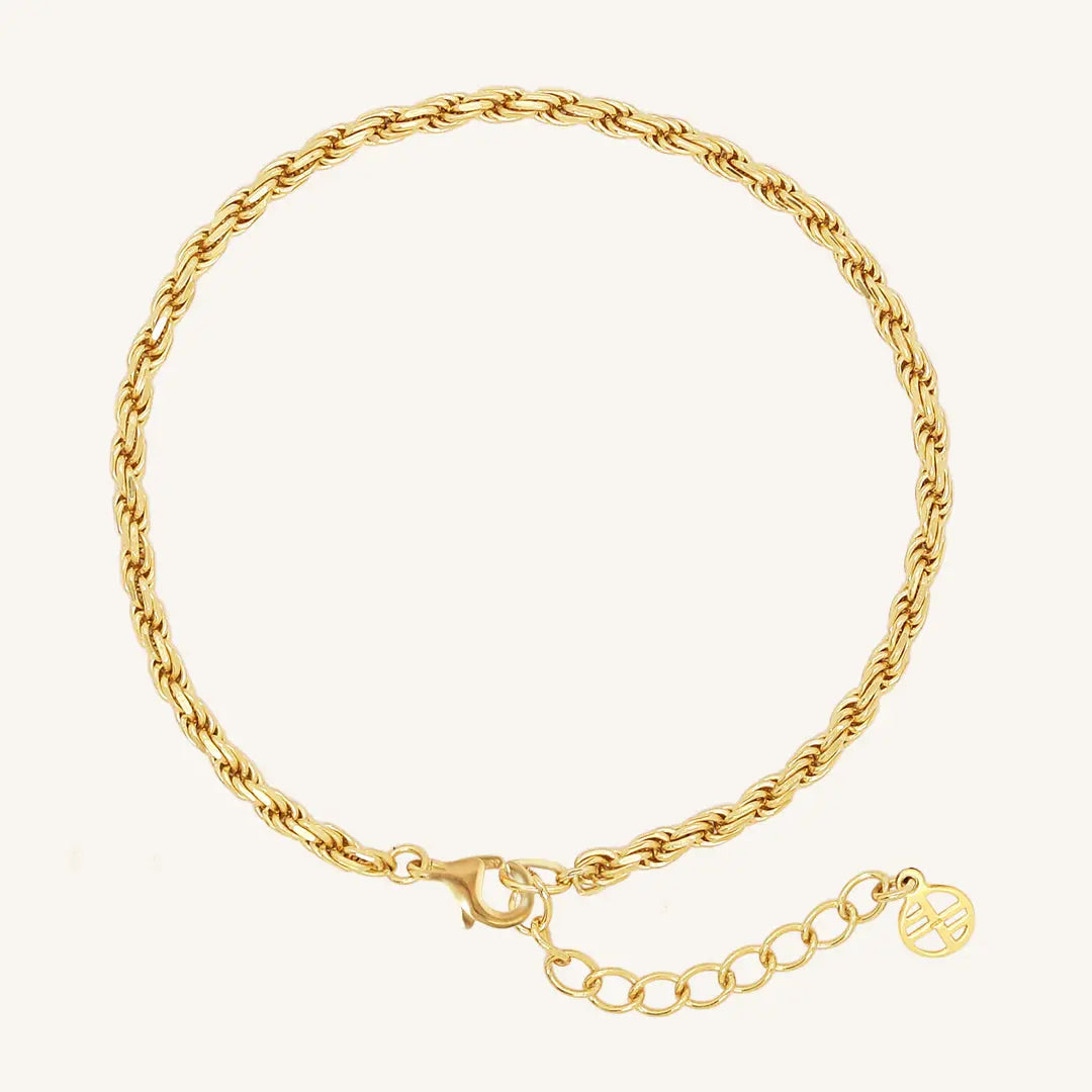 A gold-tone rope bracelet with a extender chain.