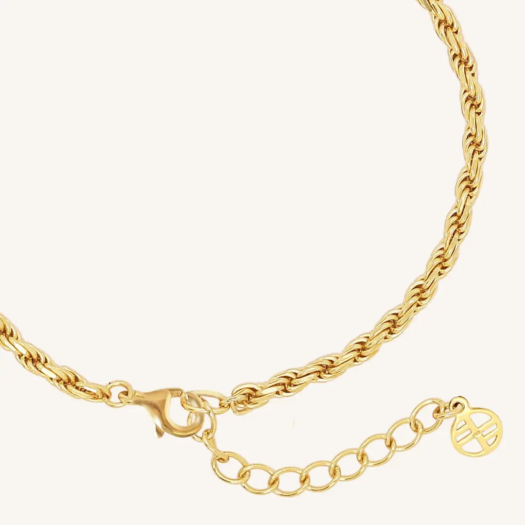 A gold-tone rope bracelet with a extender chain
