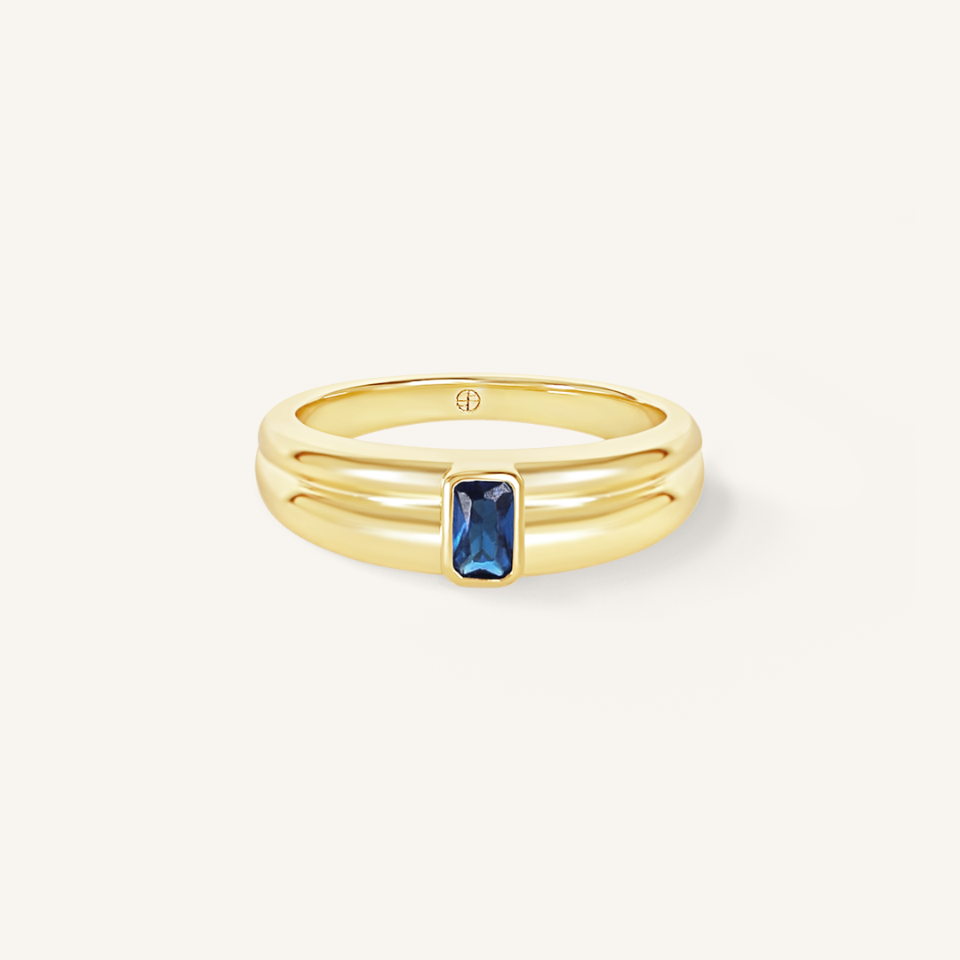Gold ring with Navy blue cubic zirconia bezel set Inspired by the halls of Versailles on white background