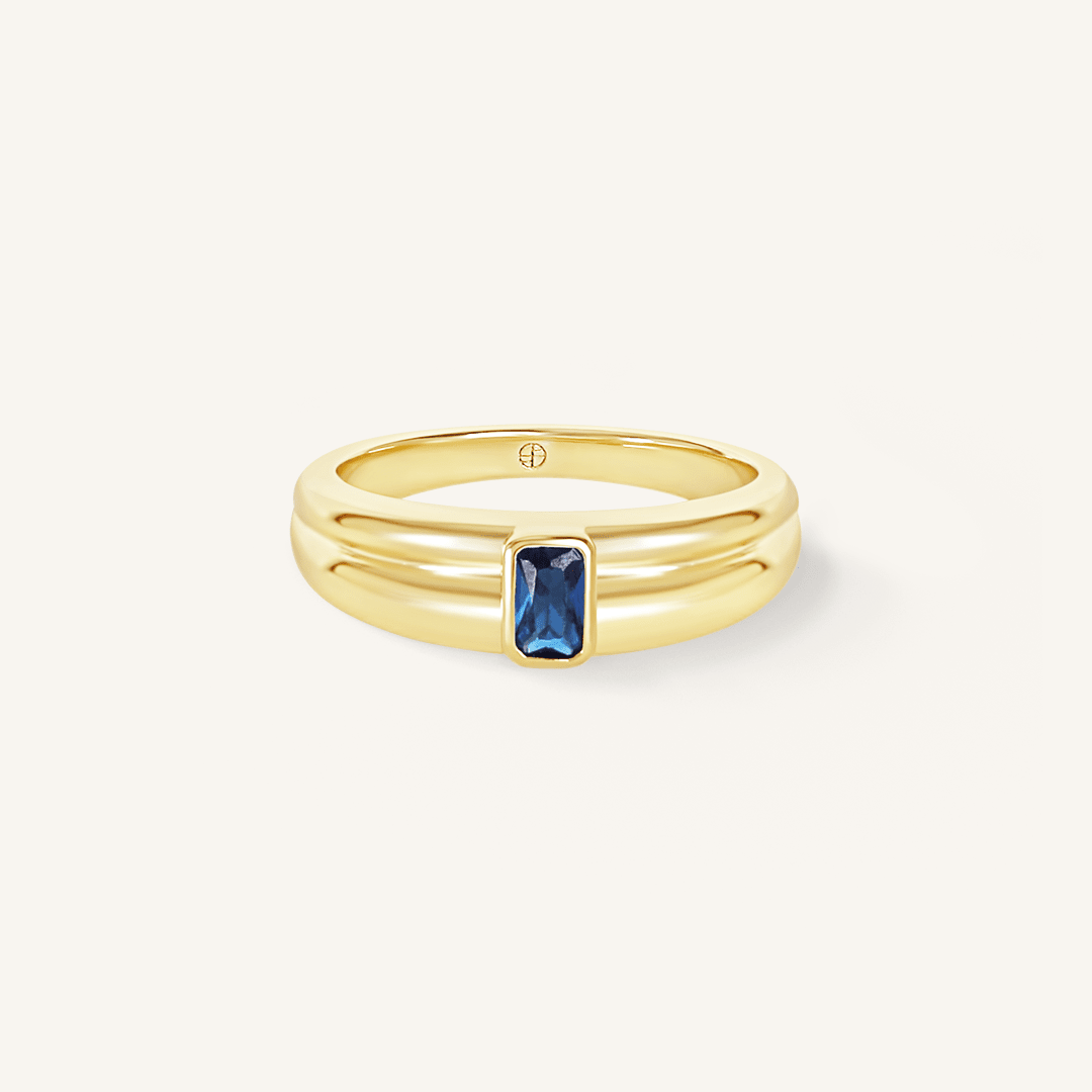 Gold ring with Navy blue cubic zirconia bezel set Inspired by the halls of Versailles on white background