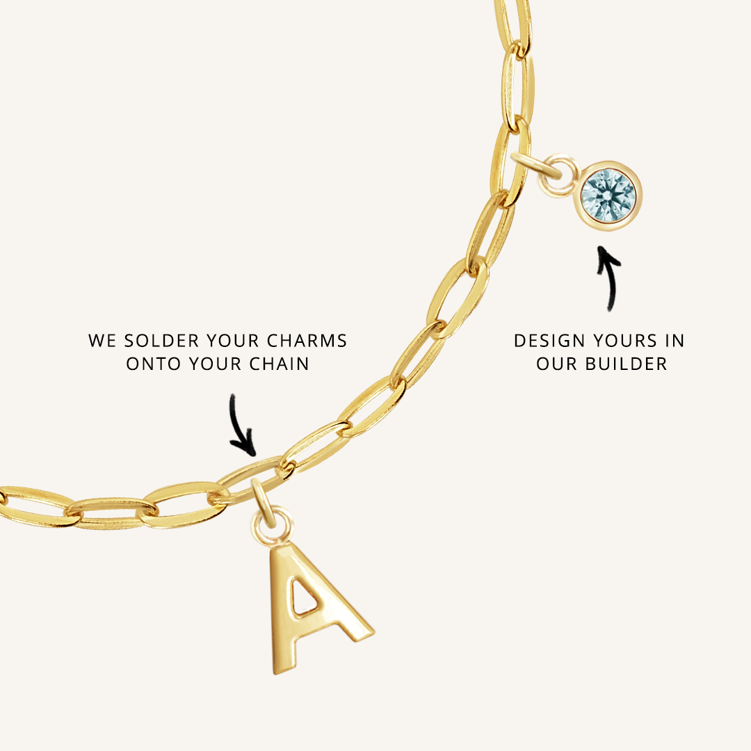 close up on gold chain with soldered charms