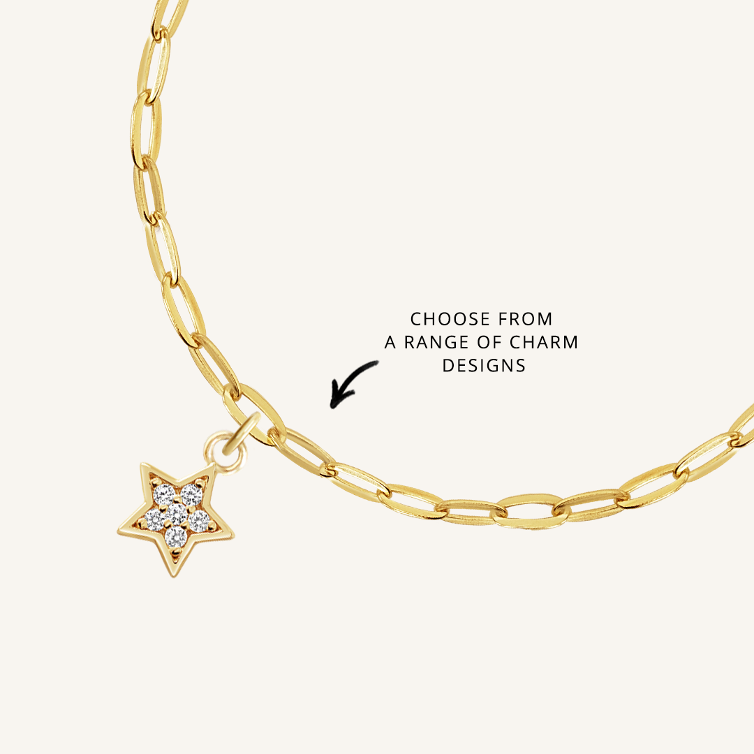 close up on gold chain with soldered charms