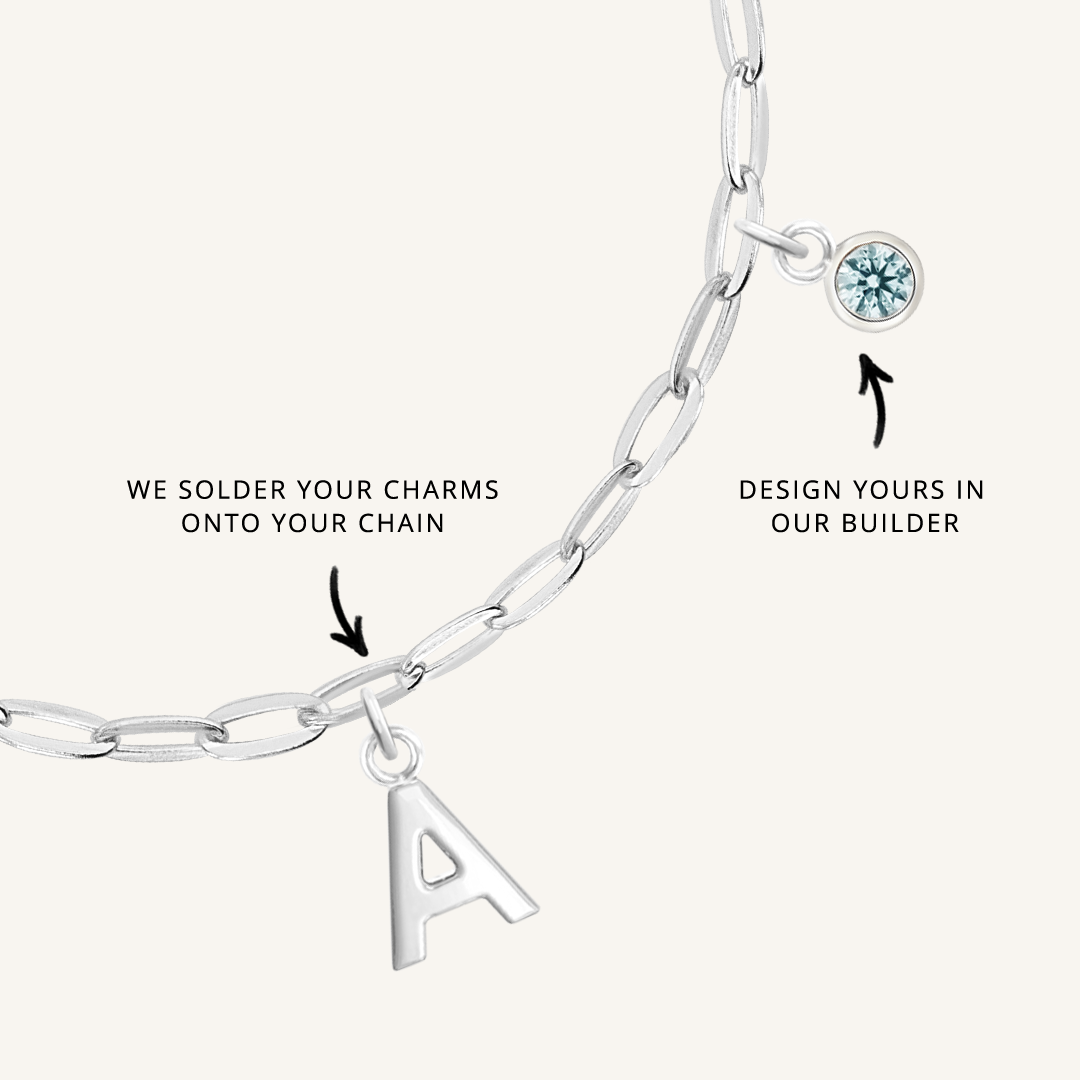 close up on silver chain with soldered charms