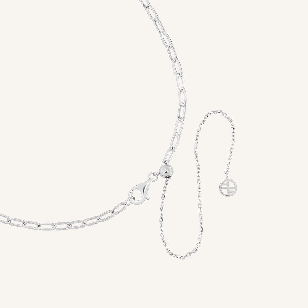 Close up on the adjustable clasp on the silver chain