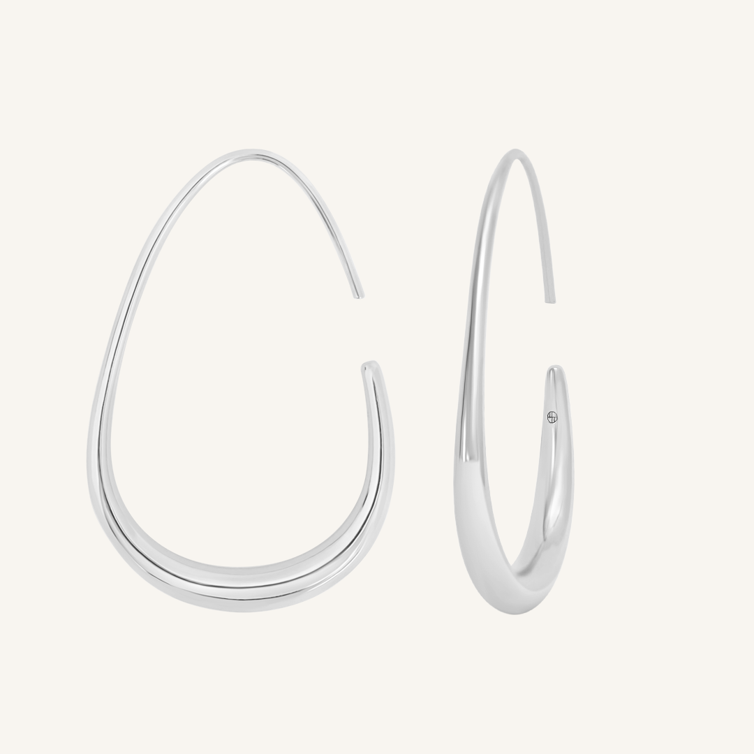 Silver hoop earrings on a white background