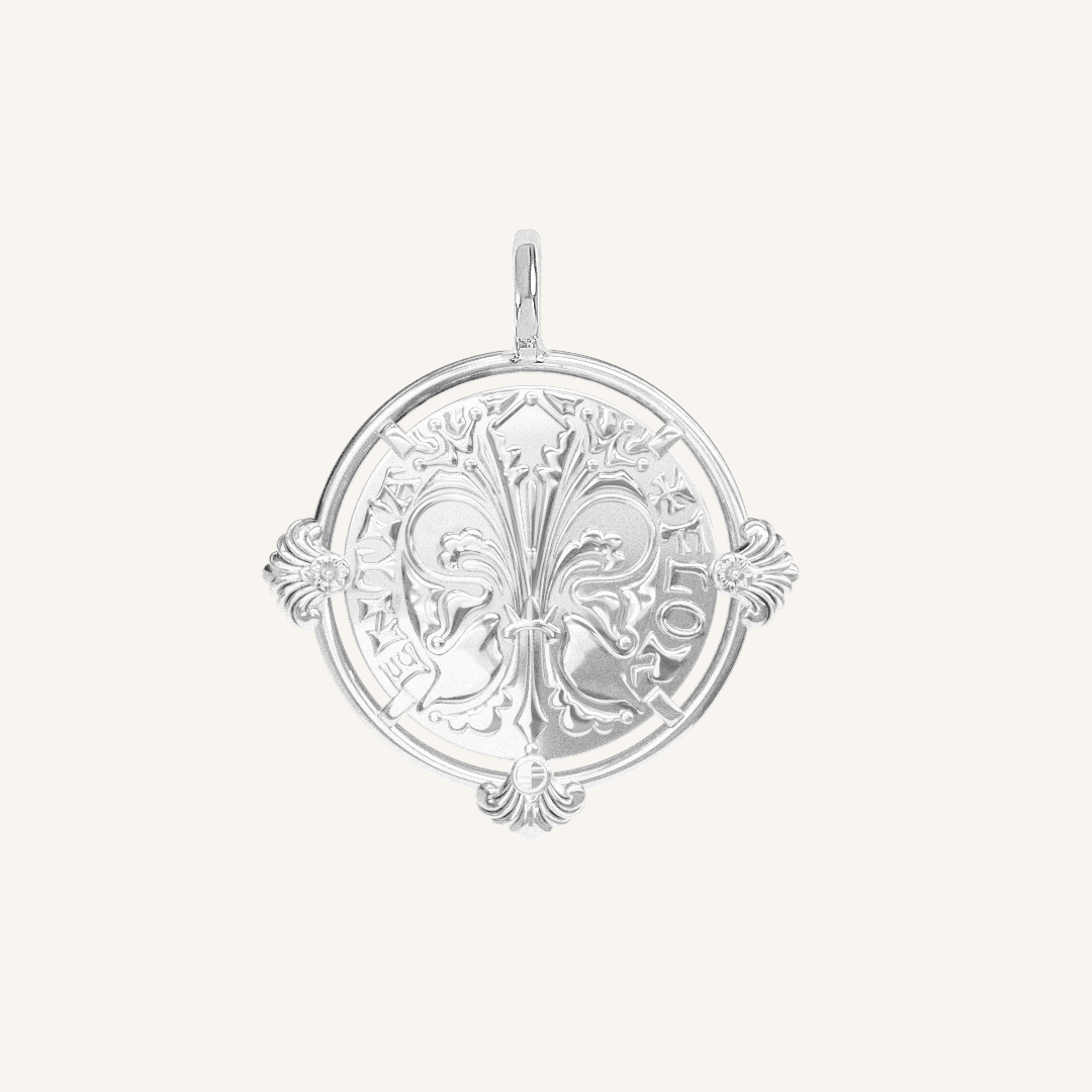 silver pendant featuring intricate patterns inspired by Palace of Versailles on a plain background