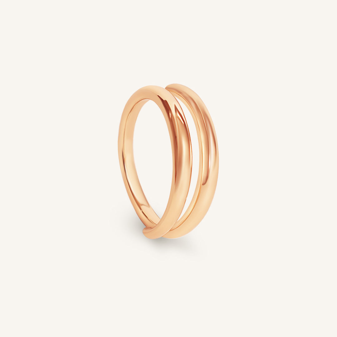 Rose gold ring on a light gray background
