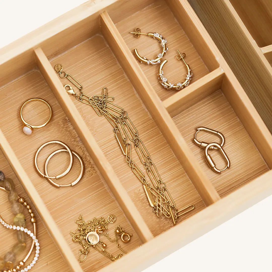 A wooden jewellery box with a lid, featuring a mirror on the inside lid, with the brand name 'Francesca' visible.