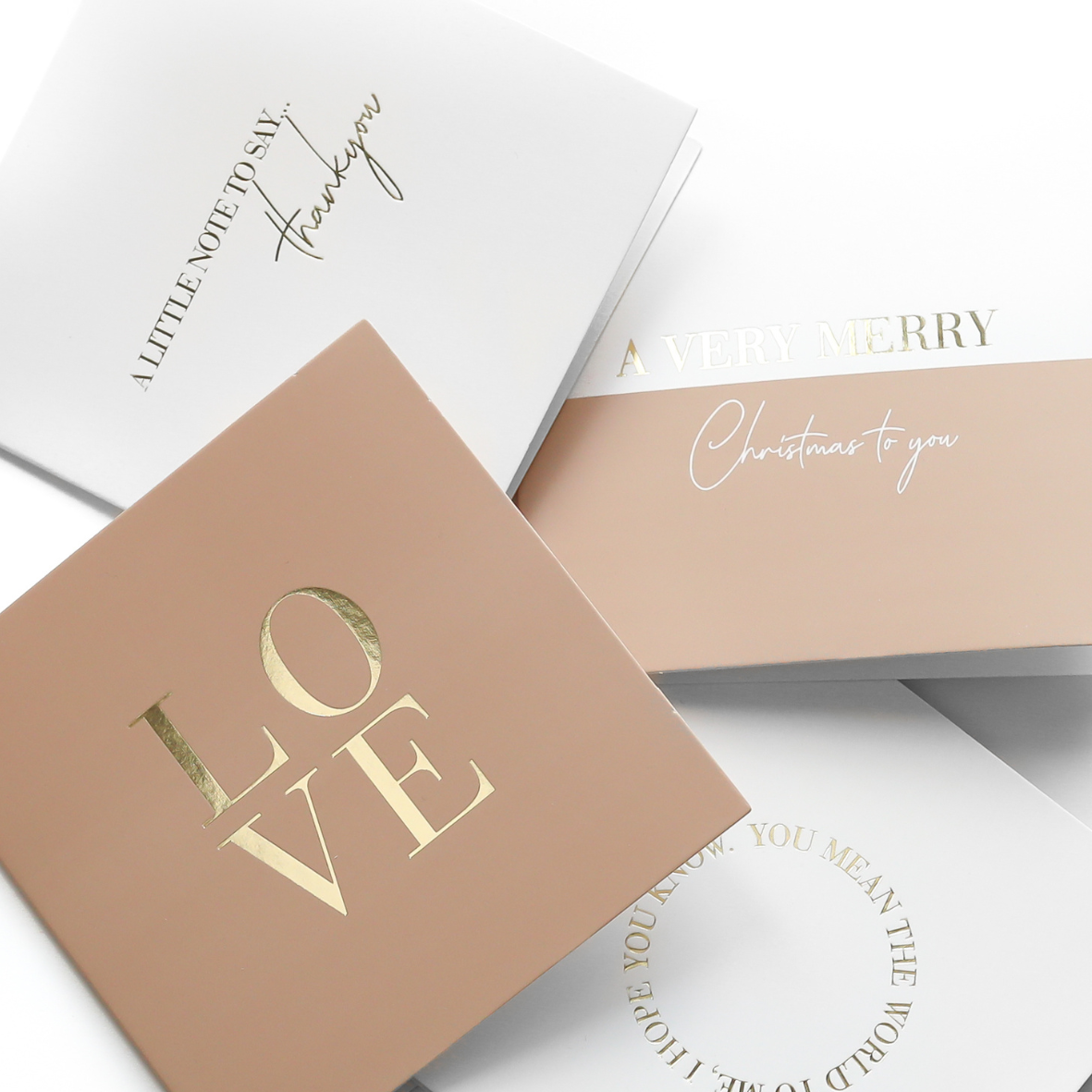 A selection of greeting cards displayed on a neutral background, featuring designs such as 'Happy Mother's Day', hearts, and the words 'mum' along with a general 'Love you mum' message.